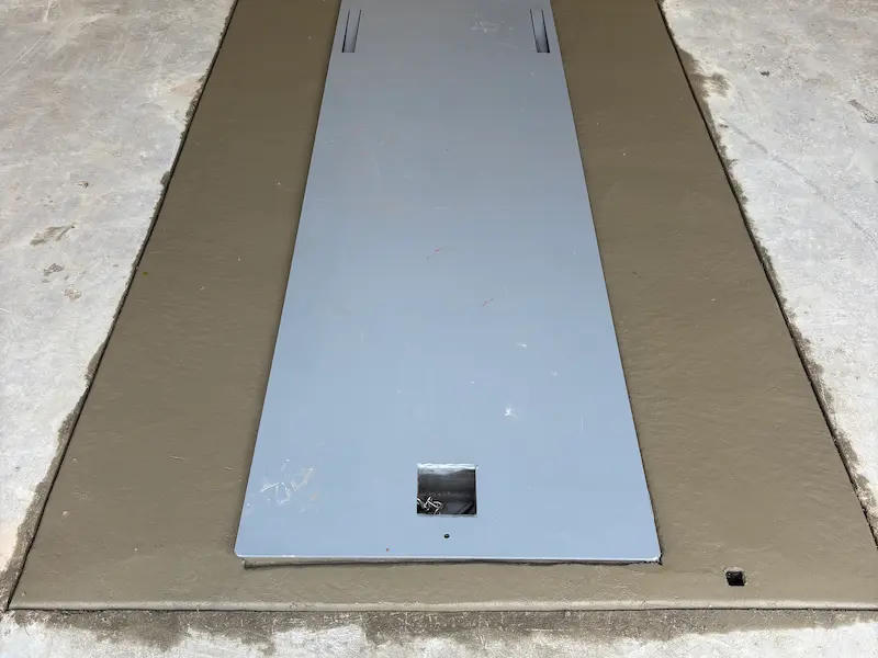 Completed FlatSafe garage lid flush with concrete